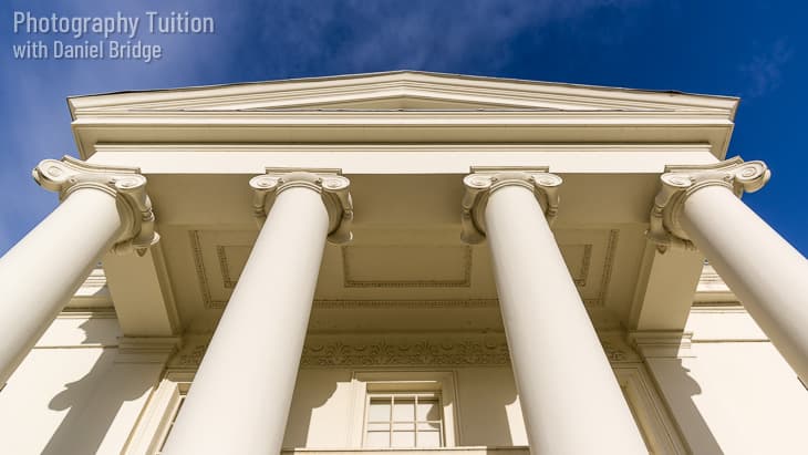 Fancy neo-classical house frontage with ionic columns