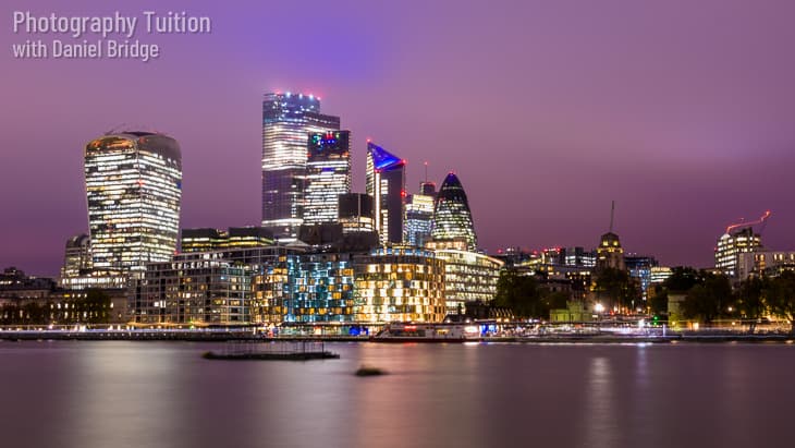 Night view across the Thames to the City of London